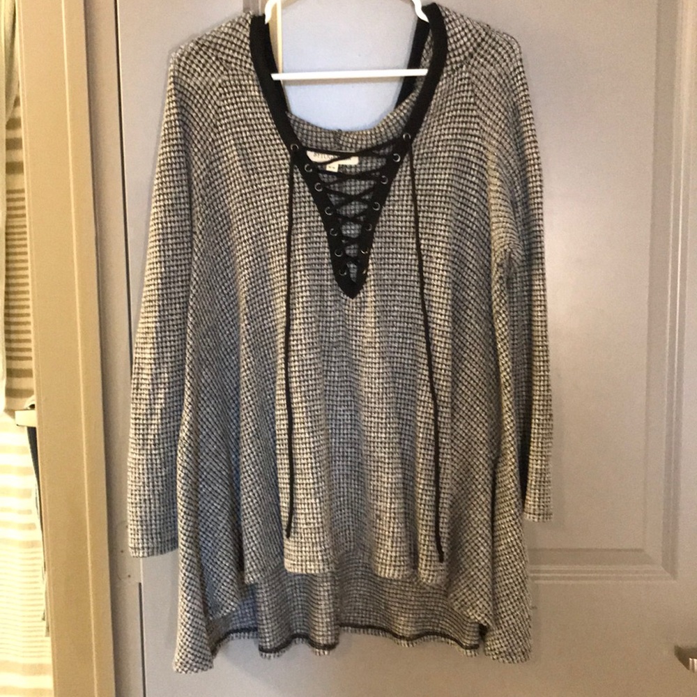Hooded sweater with cross tied neck